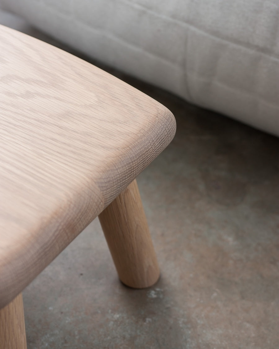Wooden stool with a plain background