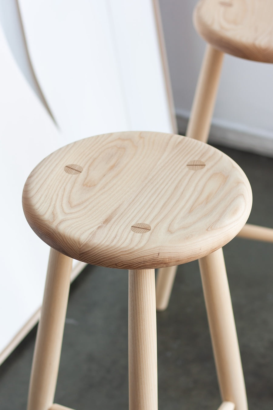 Wooden stool with a plain background