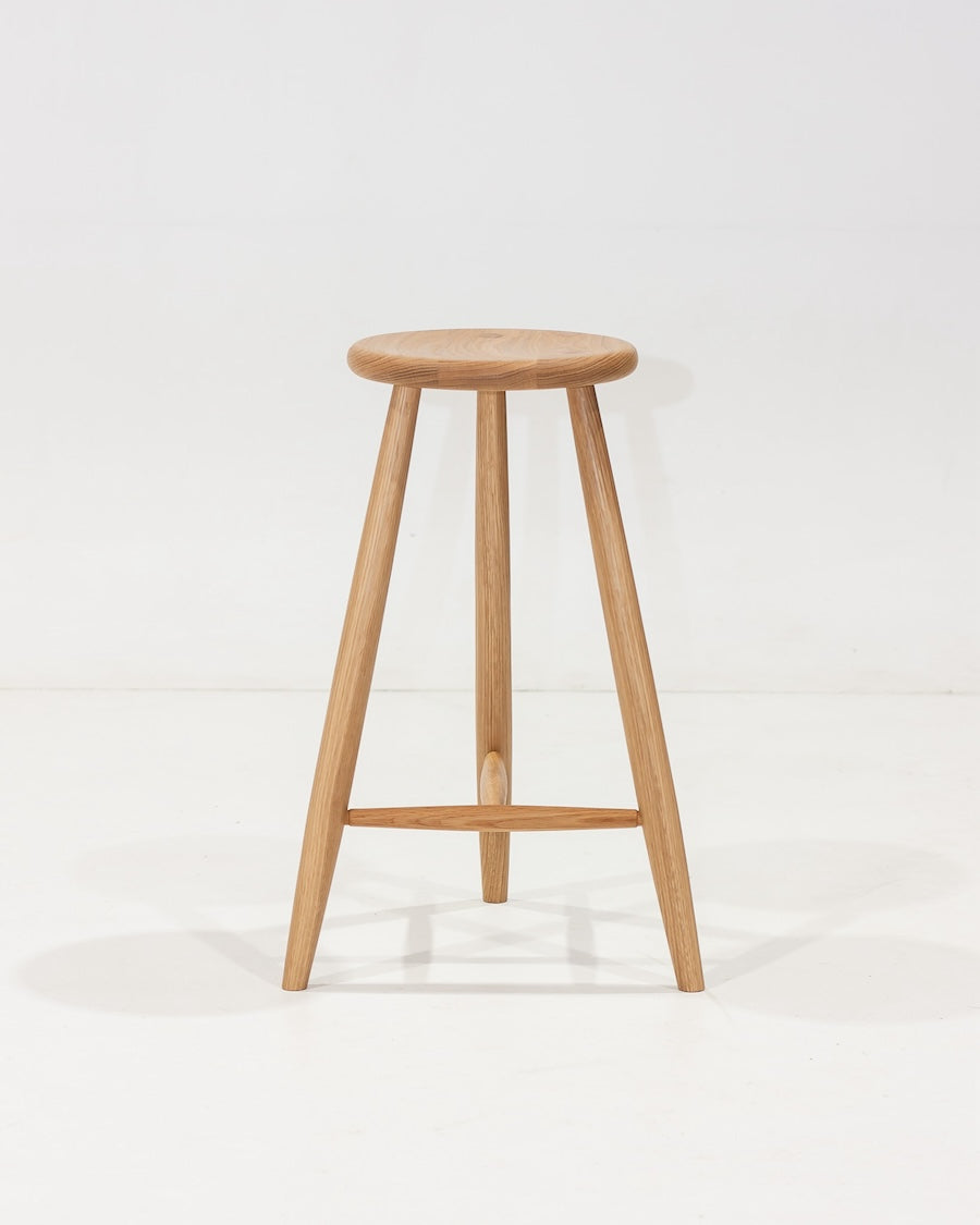 Wooden bar stool on a white background